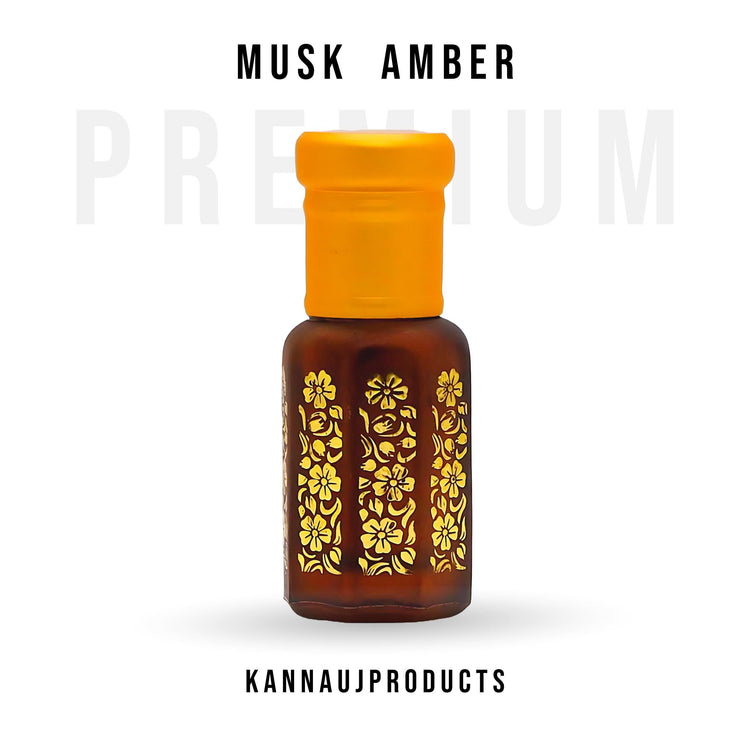 Bottle of Amber attar from Kannauj in brown glass with yellow cap and gold floral design for premium musk amber collection