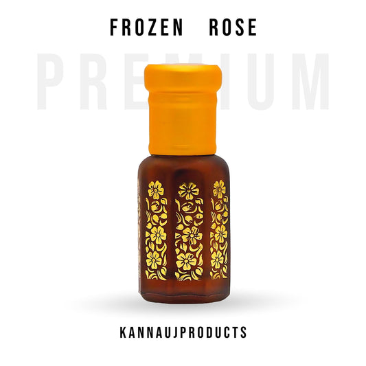 Kannauj Products premium rose attar oil in a small brown glass bottle with yellow cap and gold floral design