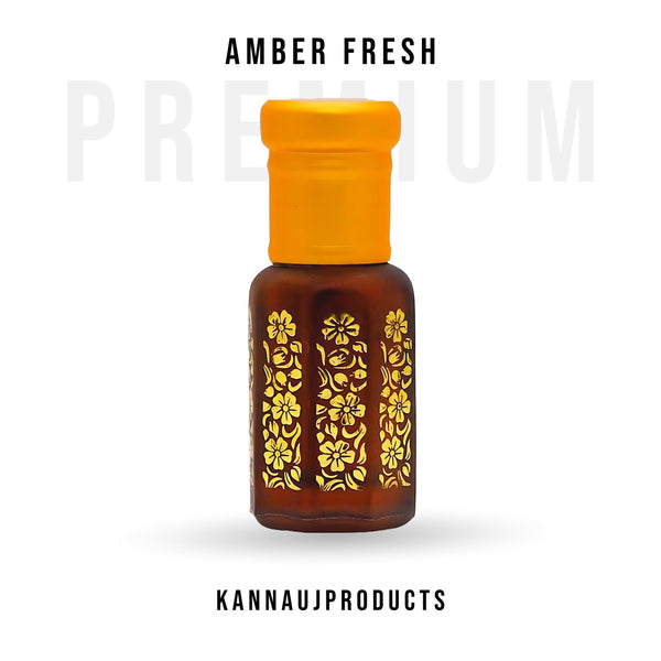 Kannauj Products amber attar perfume oil in brown glass bottle with yellow cap and gold floral pattern