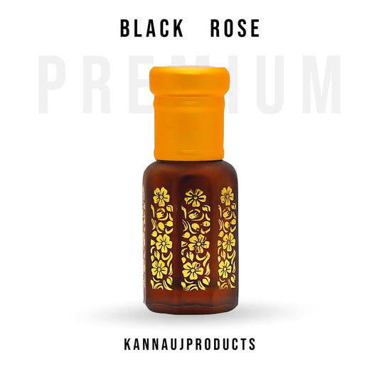Kannauj Products black rose attar oil in a brown bottle with yellow floral design and orange cap