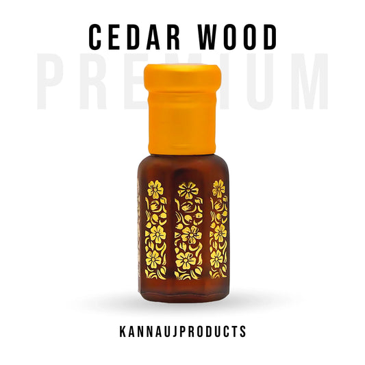 Kannauj products cedarwood attar non-alcoholic in a brown bottle with yellow floral designs and orange cap