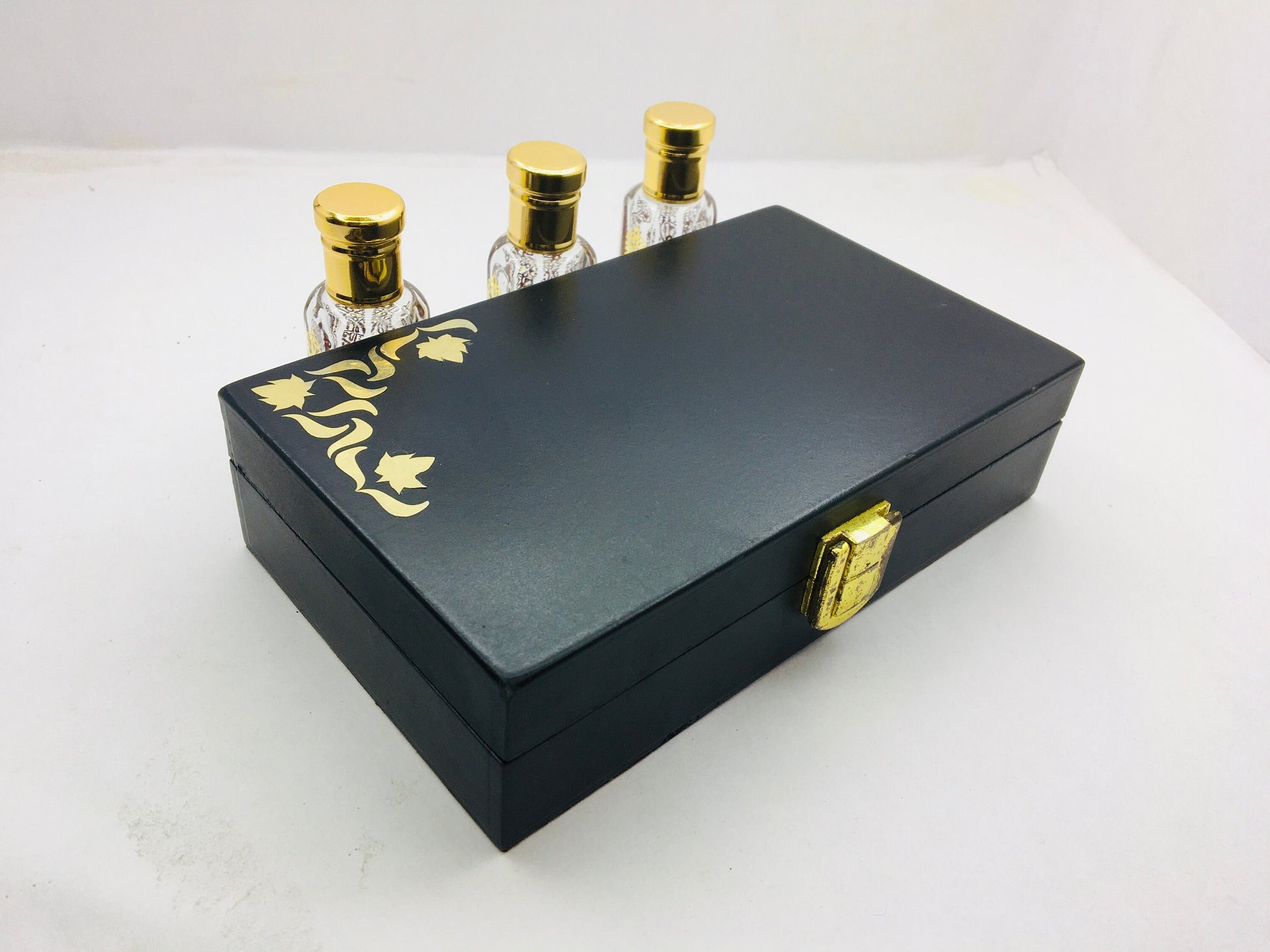 Kannauj Products premium musk attar combo pack black gift box with gold floral detail and three glass bottles