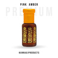 Kannauj Products pink amber attar perfume oil in amber glass bottle with yellow cap and gold floral design