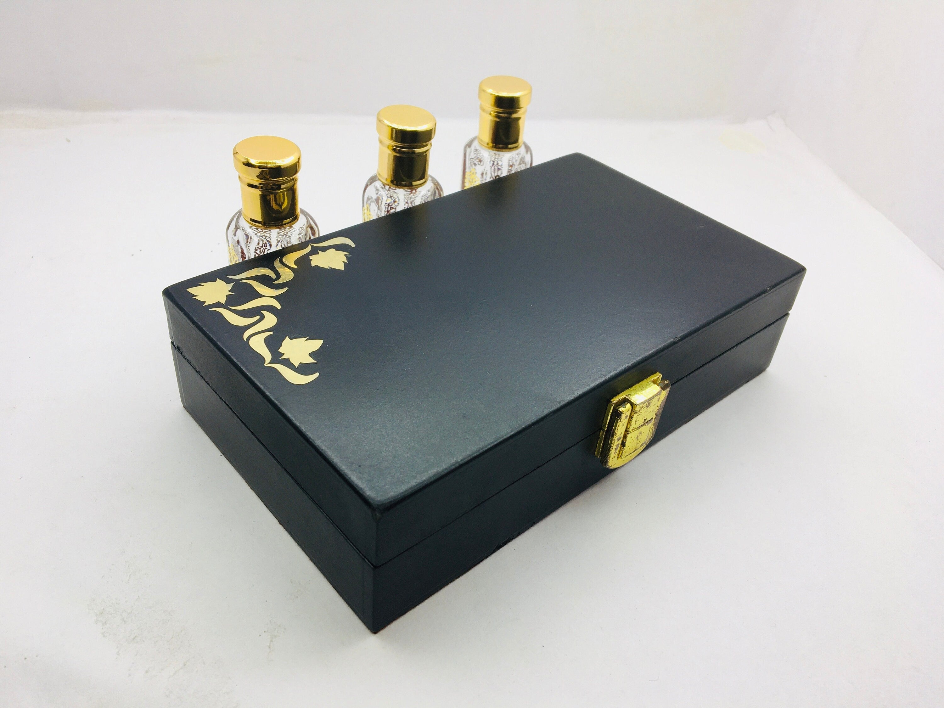 Kannauj Products premium musk attar combo pack black gift box with gold floral detail and three glass bottles