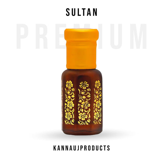 Sultan attar oil amber glass bottle with yellow cap and gold floral design for premium fragrance